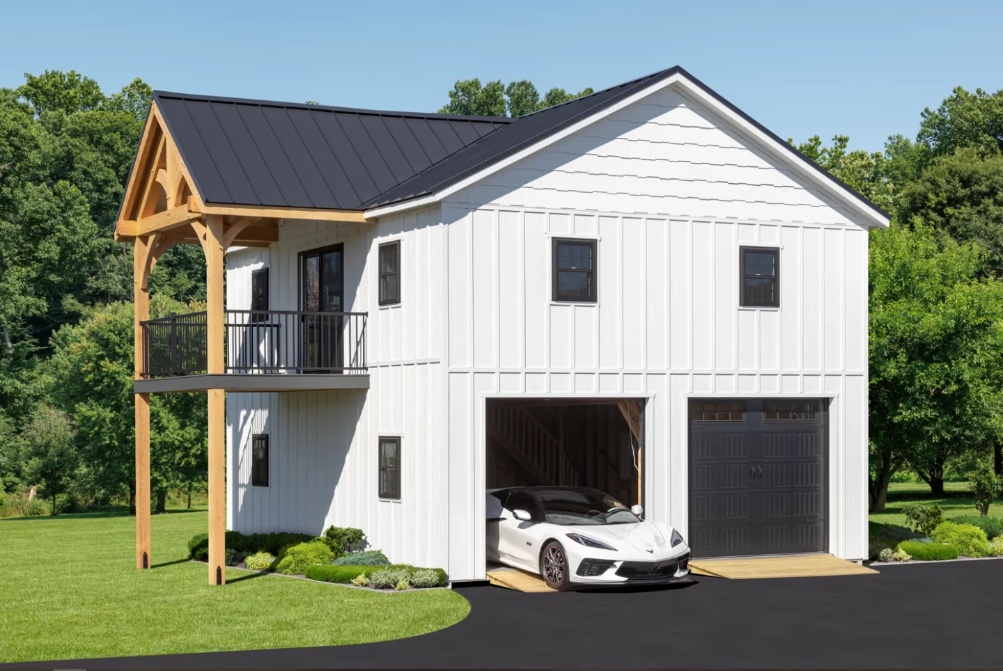 White two-story garage with balcony, timber frame porch, and sports car in garage bay