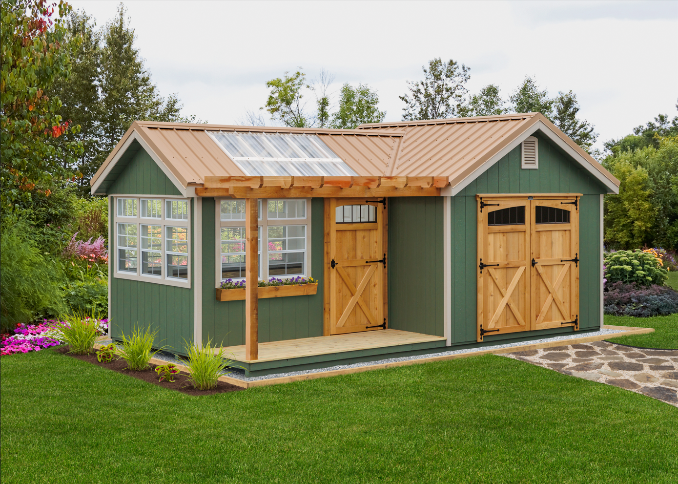 Small octagon greenhouse with cedar siding and cupola in a garden