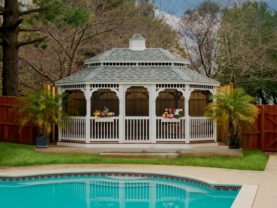 A-frame pavilion with metal roof, wood beams, and outdoor seating