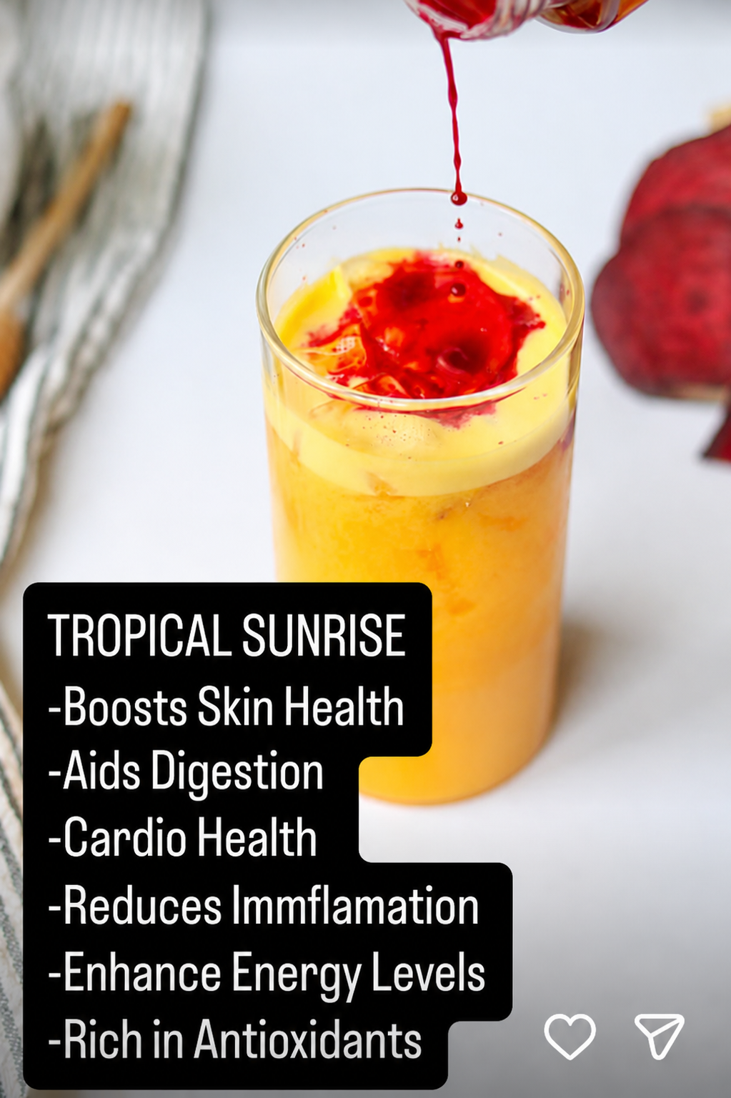 Tropical Sunrise raw pressed juice with a beet swirl garnish